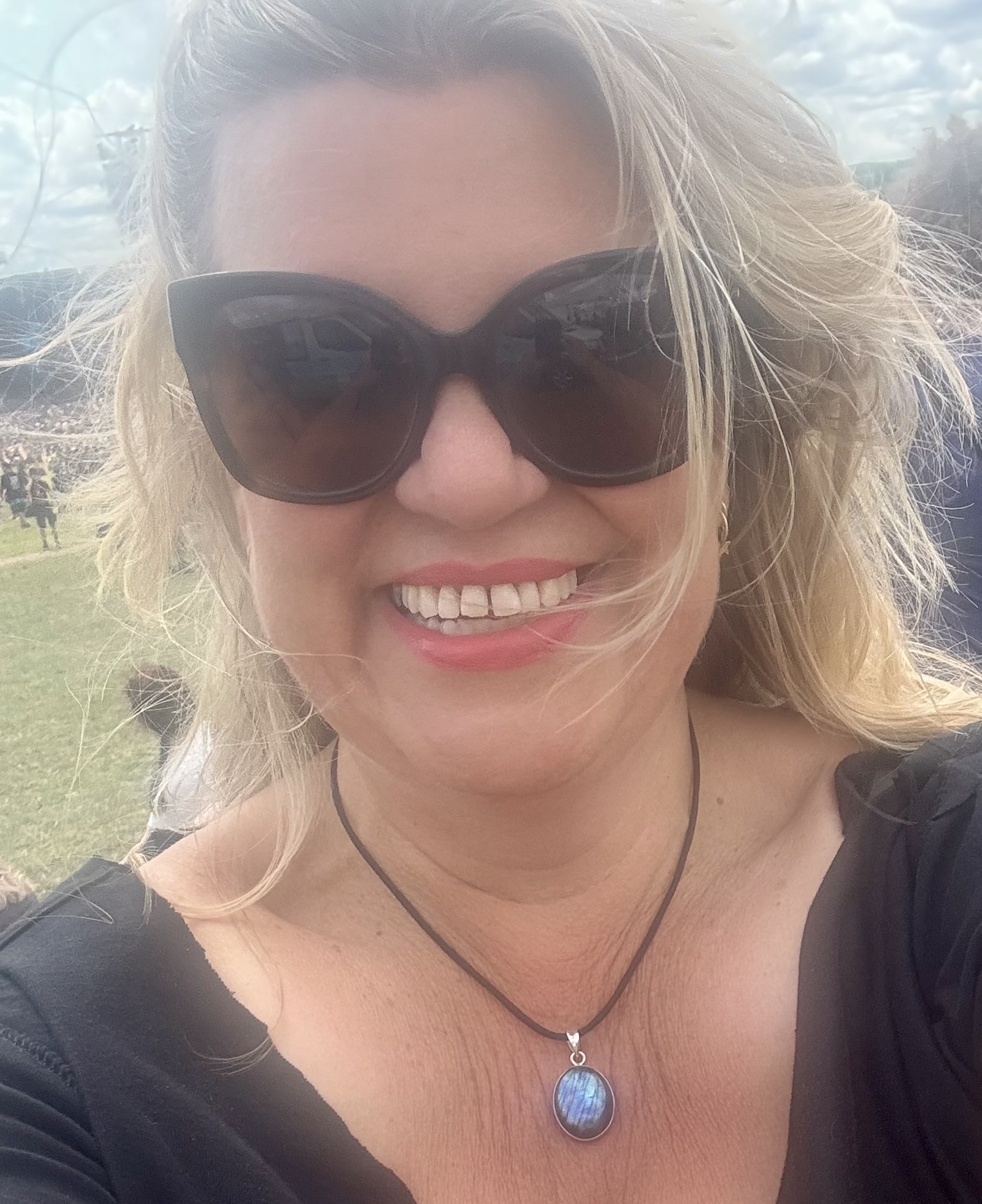 Lisa Hudson smiling at a live music event.